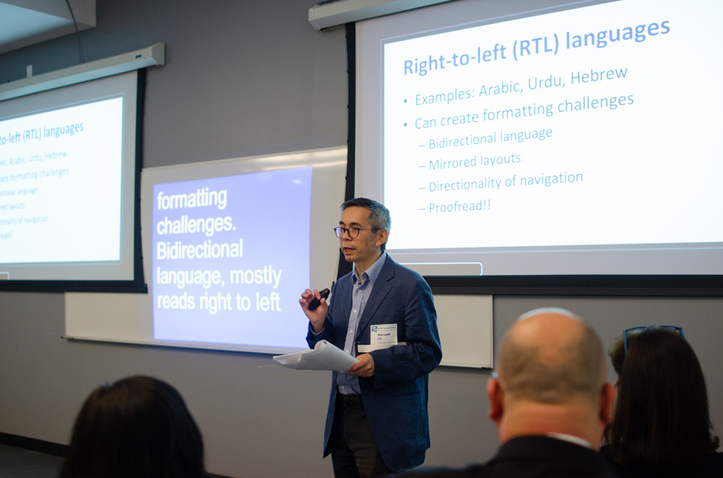 Ken Lo from MOIA presenting on accessible website for right-to-left languages. CART service is projected onto the whiteboard next to the presentation slides.